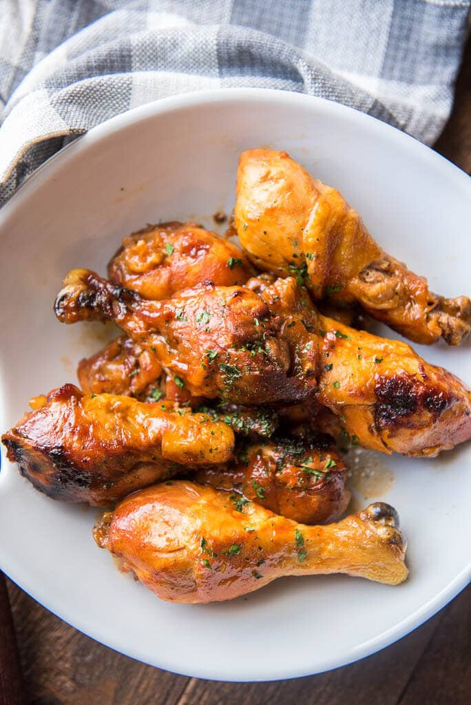 Slow Cooker Buffalo Chicken Drumsticks on white plate