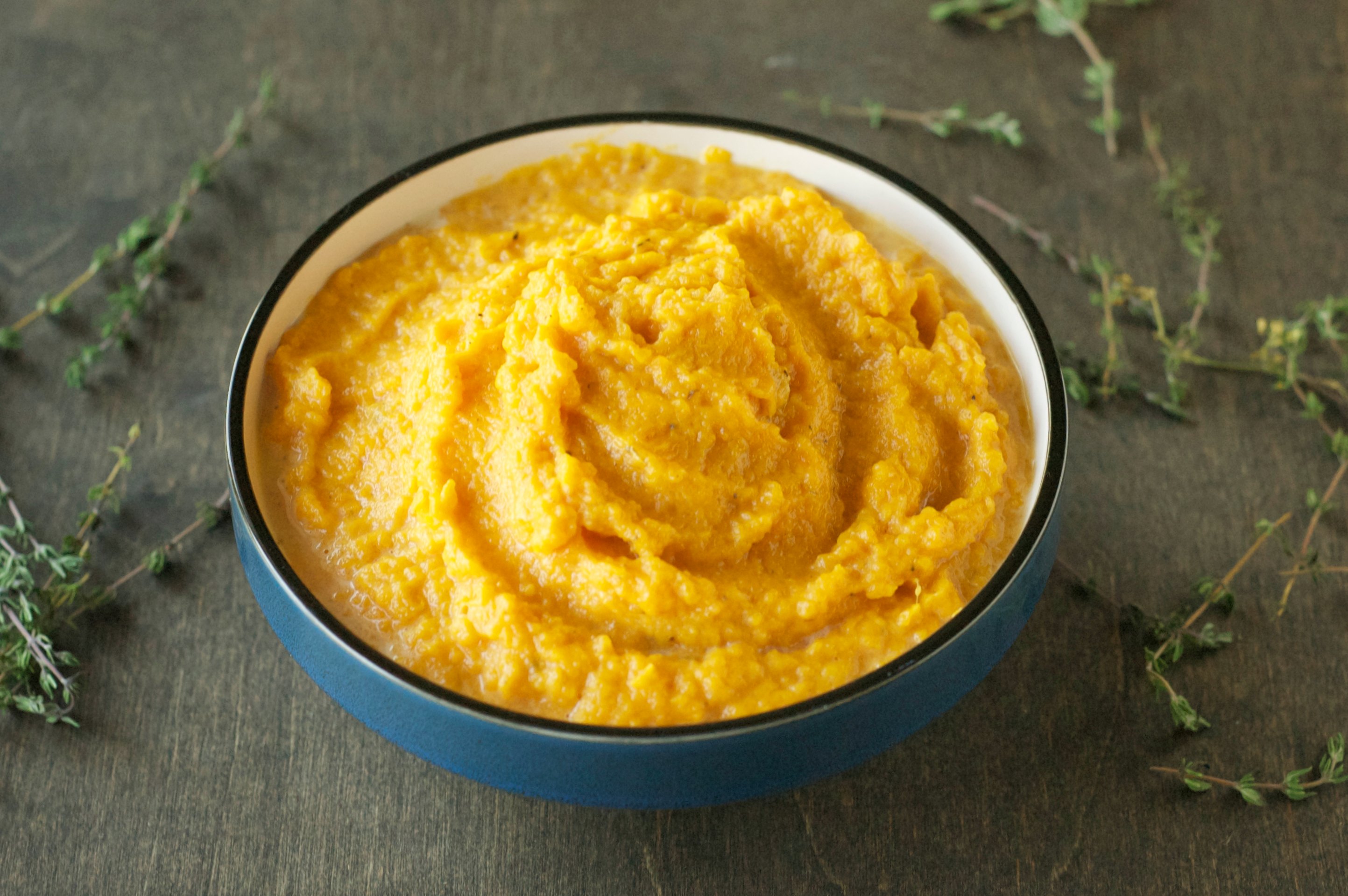 blue bowl with mashed sweet potatoes