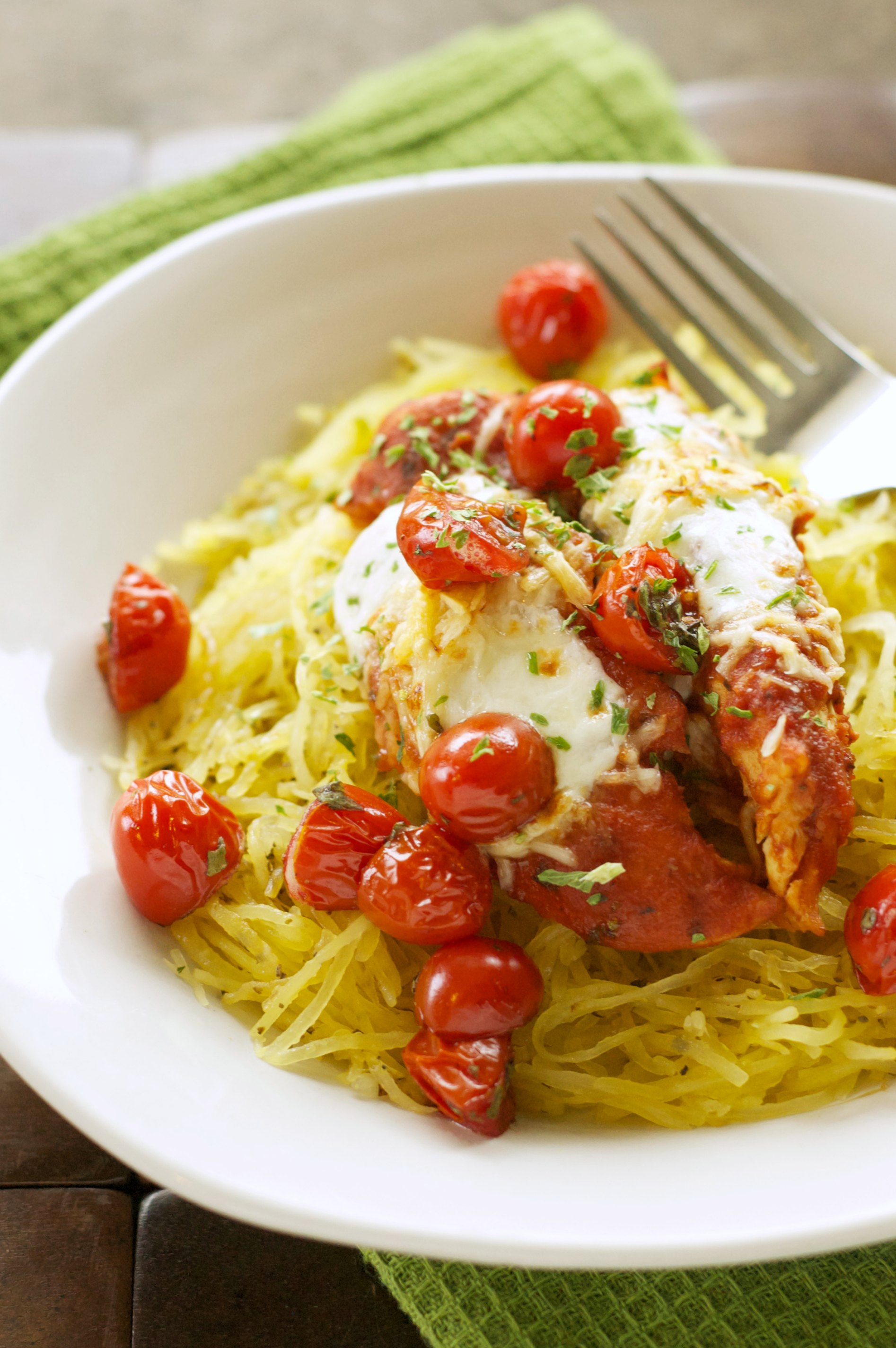 chicken, spaghetti squash and tomatoes in white bowl 