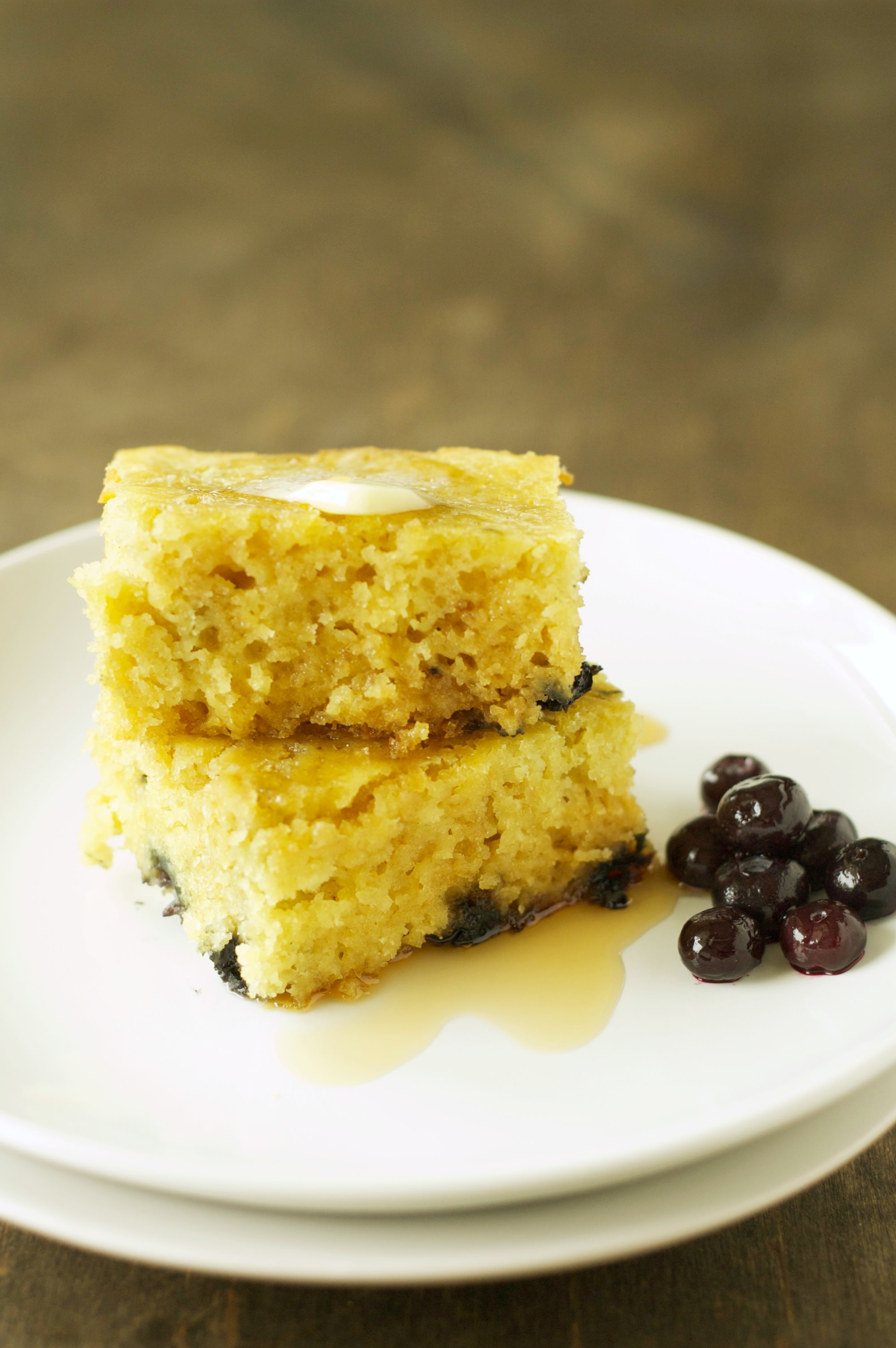 Two stacked Slow Cooker Blueberry Vanilla Pancakes on white plate