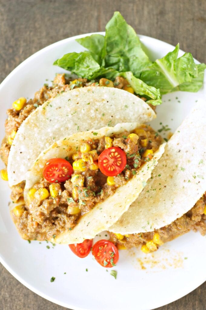 Slow Cooker Cheesy Beefy Tacos on white plate