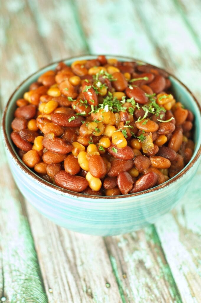 Slow Cooker Honey BBQ Baked Beans in green bowl