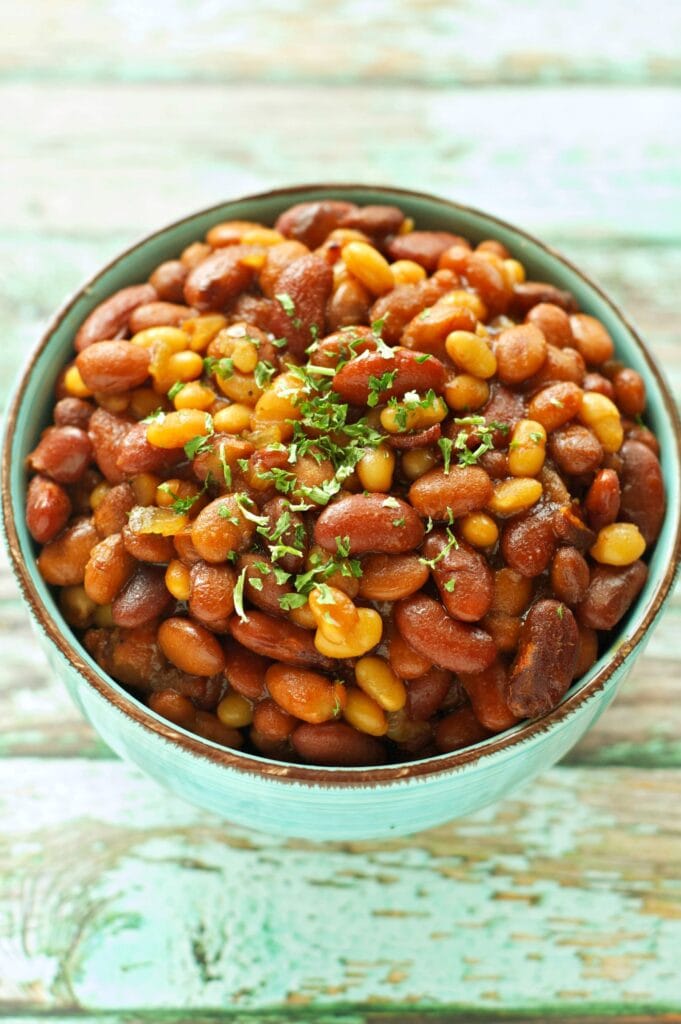 Slow Cooker Honey BBQ Baked Beans in green bowl