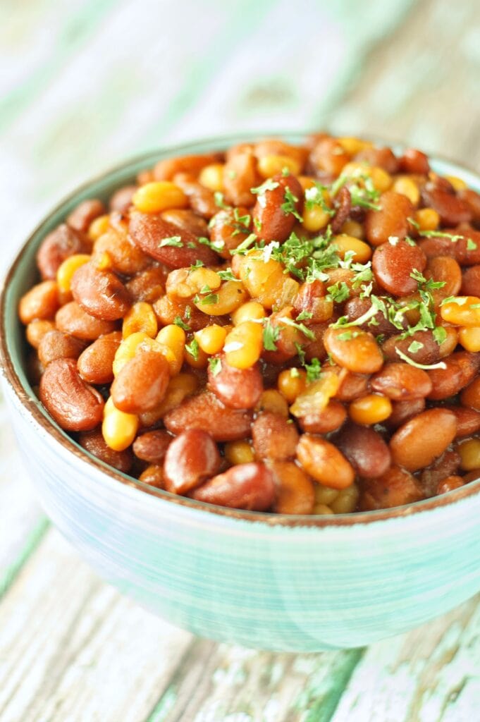 Slow Cooker Honey BBQ Baked Beans in green bowl