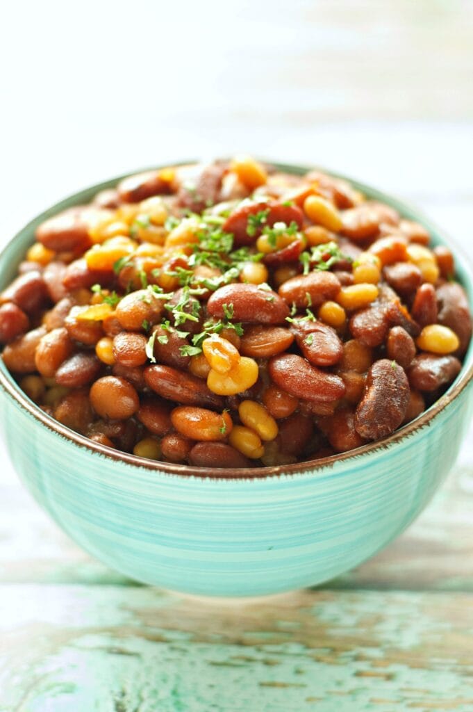 Slow Cooker Honey BBQ Baked Beans in green bowl