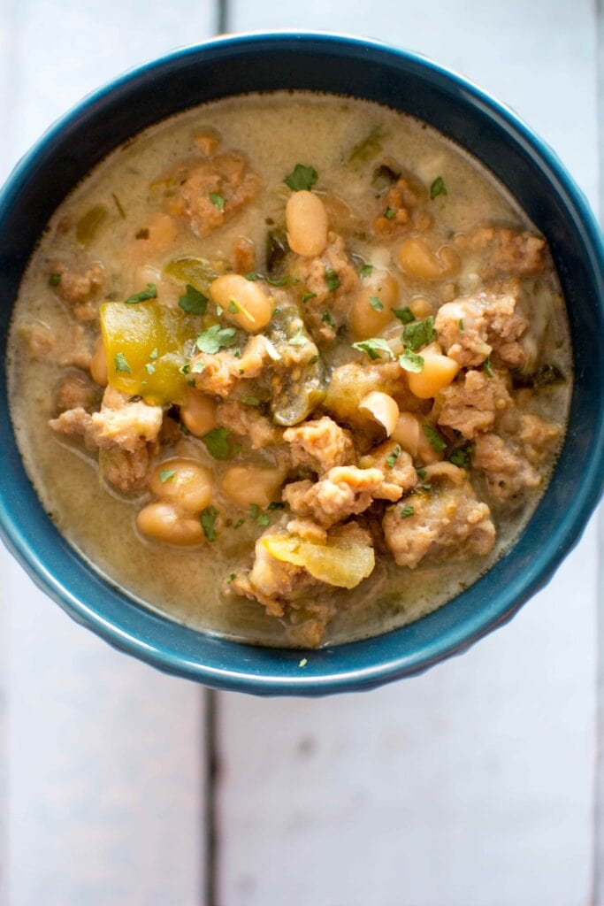 Slow Cooker Cheesy Green Chili in blue bowl