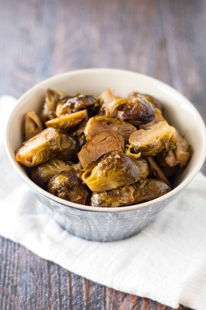 Slow Cooker Roasted Brussels Sprouts in blue bowl