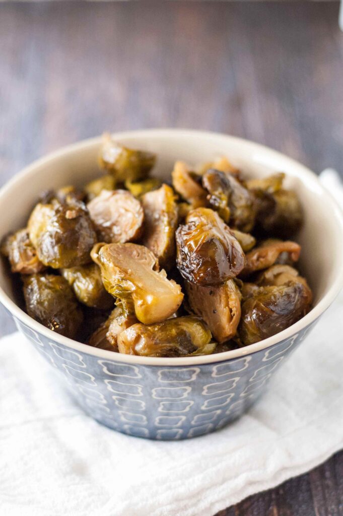 Slow Cooker Roasted Brussels Sprouts in blue bowl