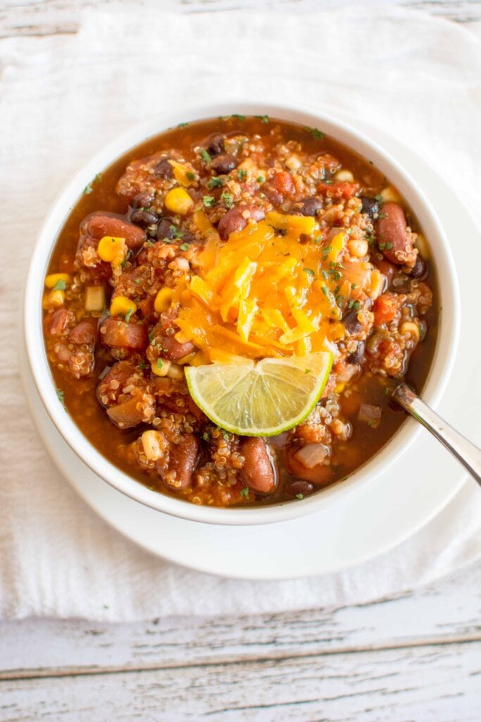 Slow Cooker Quinoa Chili in white bowl with spoon