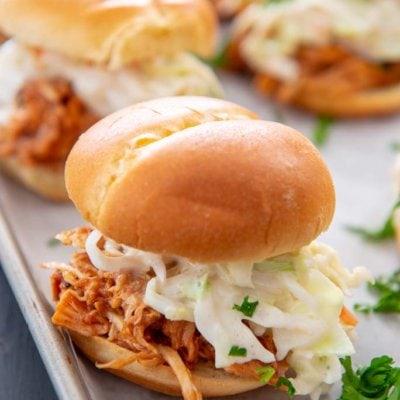 Slow Cooker BBQ Pulled Chicken on Hawaiian slider bun topped with coleslaw