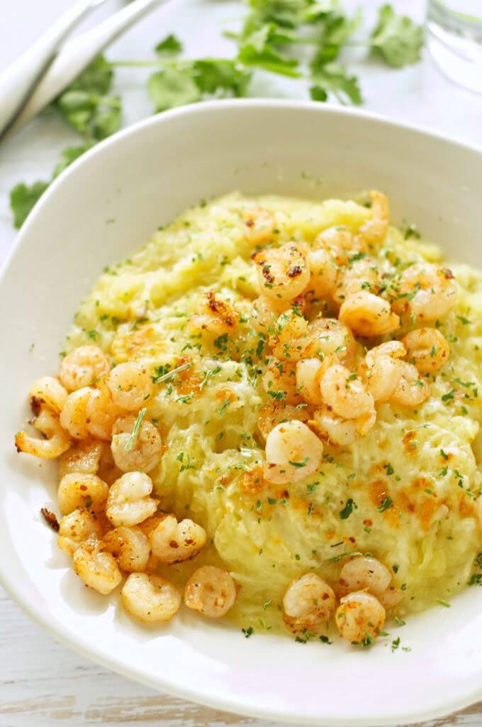 white bowl filled with spaghetti squash and shrimp