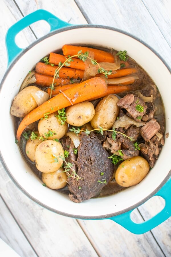balsamic roast with carrots and potatoes in turquoise dutch oven