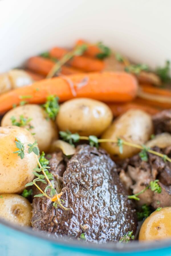 closeup of balsamic roast with carrots and potatoes in slow cooker