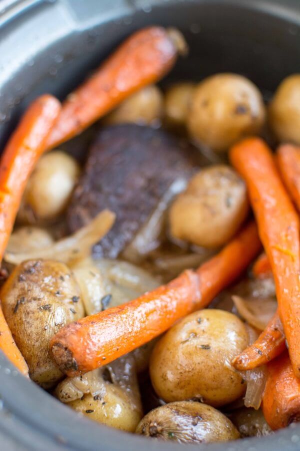 closeup of balsamic roast with carrots and potatoes in slow cooker