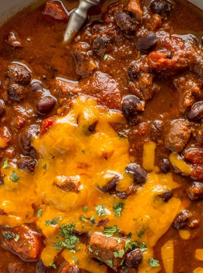 closeup of beefy chili with spoon