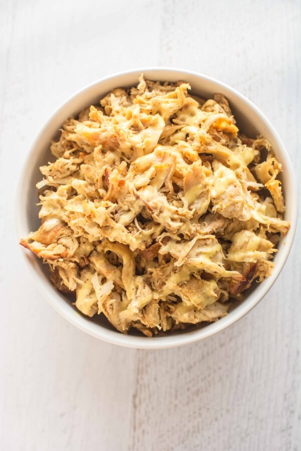 pulled chicken in white bowl