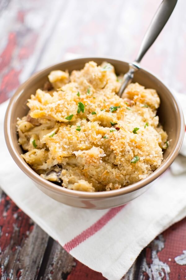 five cheese chicken bacon pasta in brown bowl with spoon