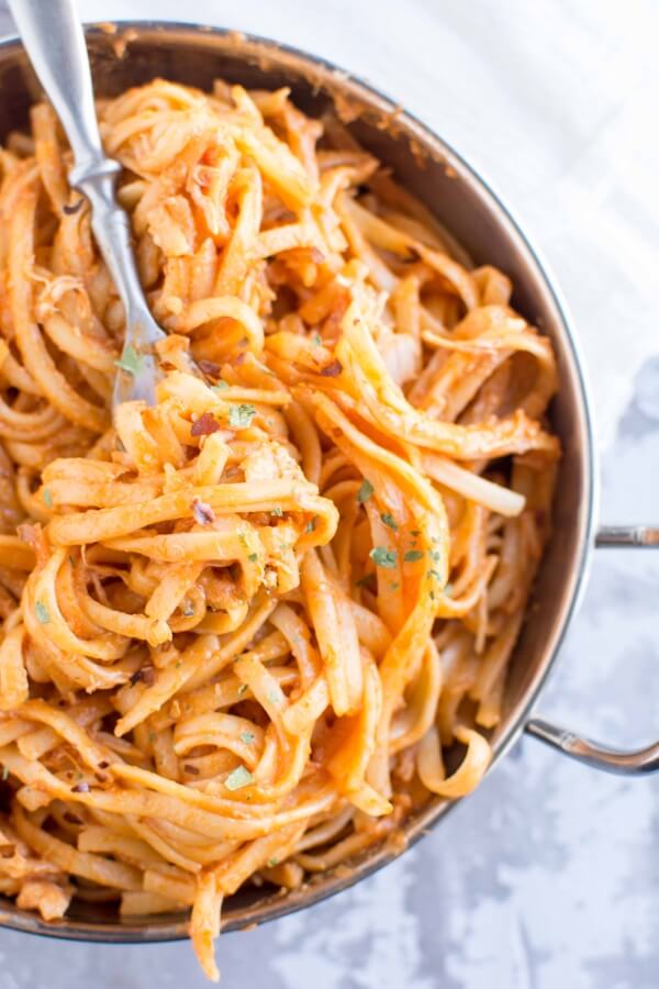 bowl with firecracker chicken pasta with fork 