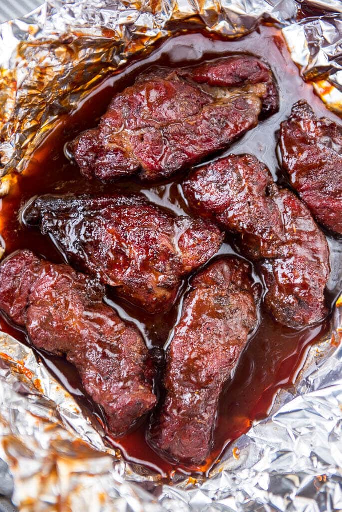 These Blueberry Chipotle Smoked BBQ Ribs are the most flavorful ribs you will eat all summer! Perfect for Food Truck Friday with a sweet spicy kick of flavor for these boneless beef ribs.