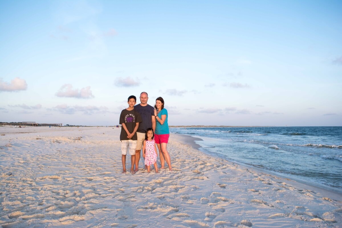 family photo on beach at Dauphin Island