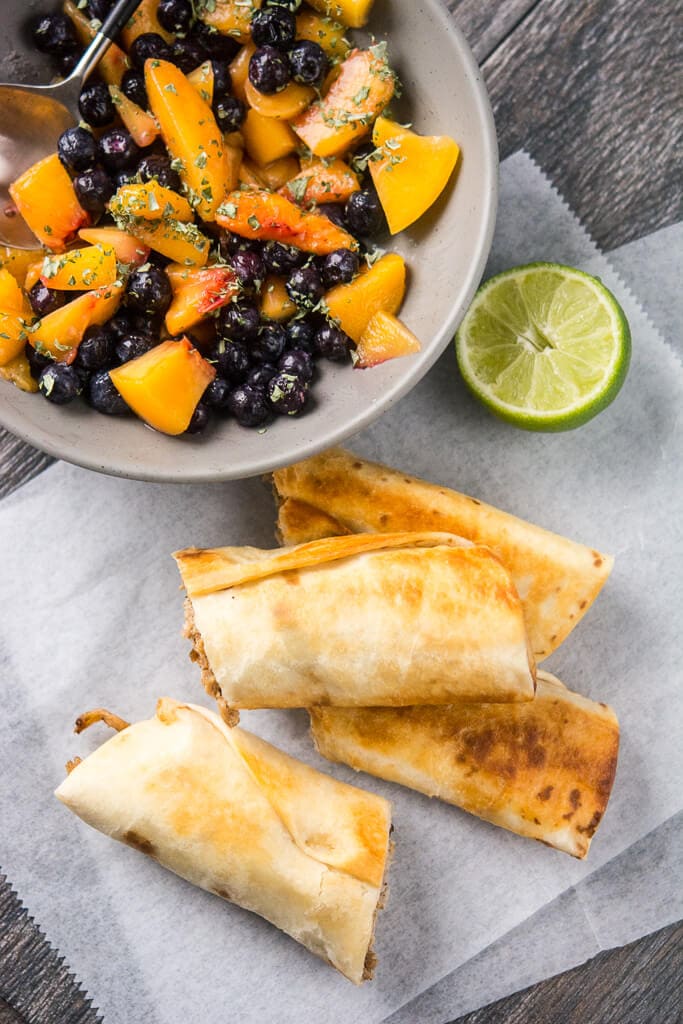 Slow Cooker Crispy Pork Flautas with Blueberry Peach Salsa