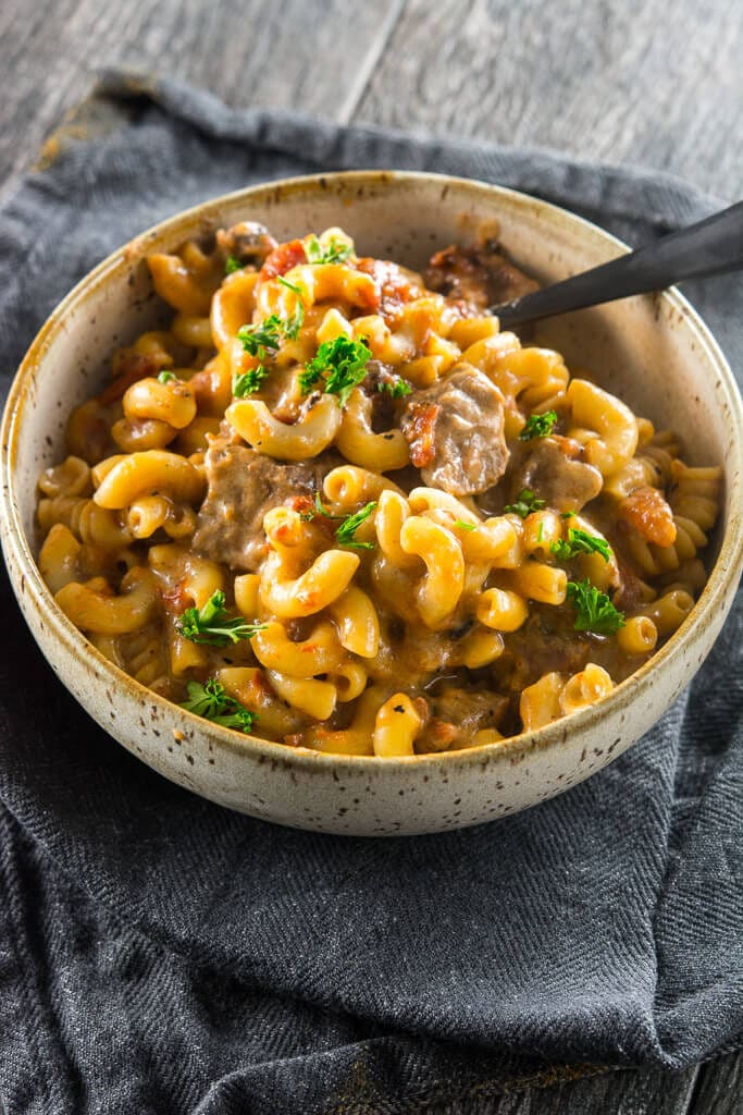 Overhead photo of Slow Cooker Beer Mac & Cheese on a grey towel