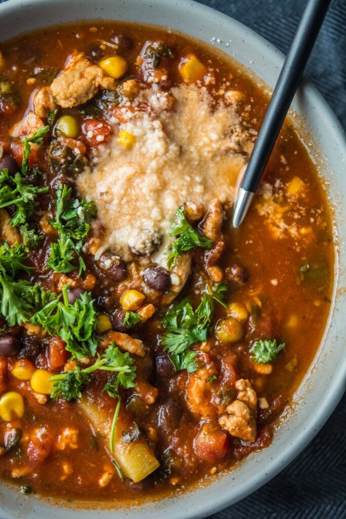 turkey vegetable soup in gray bowl