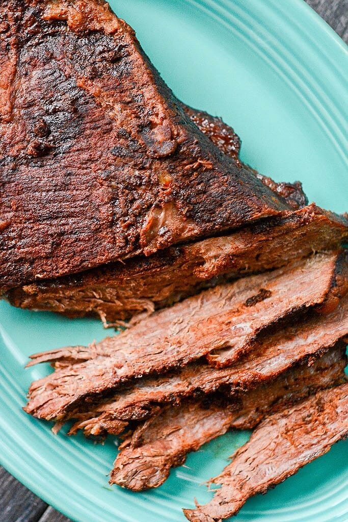 Cooked brisket on a platter - Slow Cooker Beer Braised Brisket