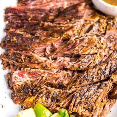 Slow Cooker Carne Asada is a simple way to make delicious tacos any night of the week! This tender delicious beef has just the right seasonings!