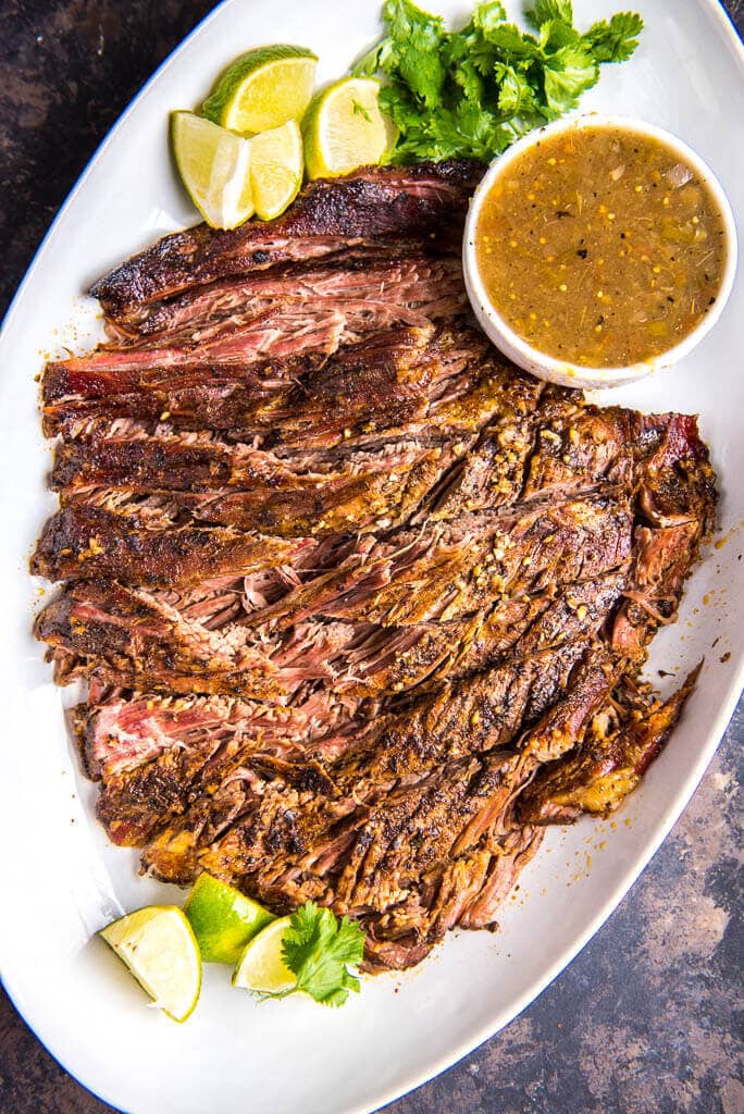 Slow Cooker Carne Asada is a simple way to make delicious tacos any night of the week! This tender delicious beef has just the right seasonings!