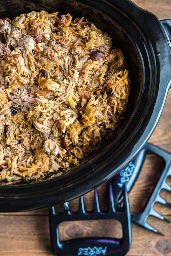 pork shredded in a slow cooker with the pulled pork shredder claws