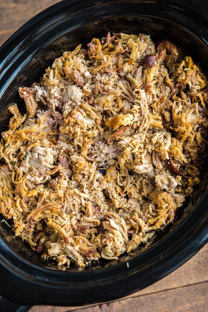 pulled pork in a black slow cooker