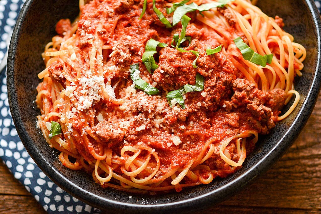 No need to stand over the stove while stirring all day long! Impress your family or dinner guests with this delicious Slow Cooker Bolognese that's so easy to make while still being so full of rich flavors.