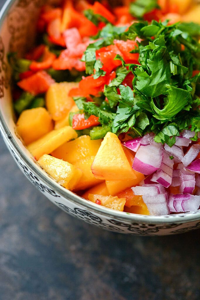 Bowl of fresh peach salsa - Slow Cooker Pork Chops with Peach Salsa Recipe