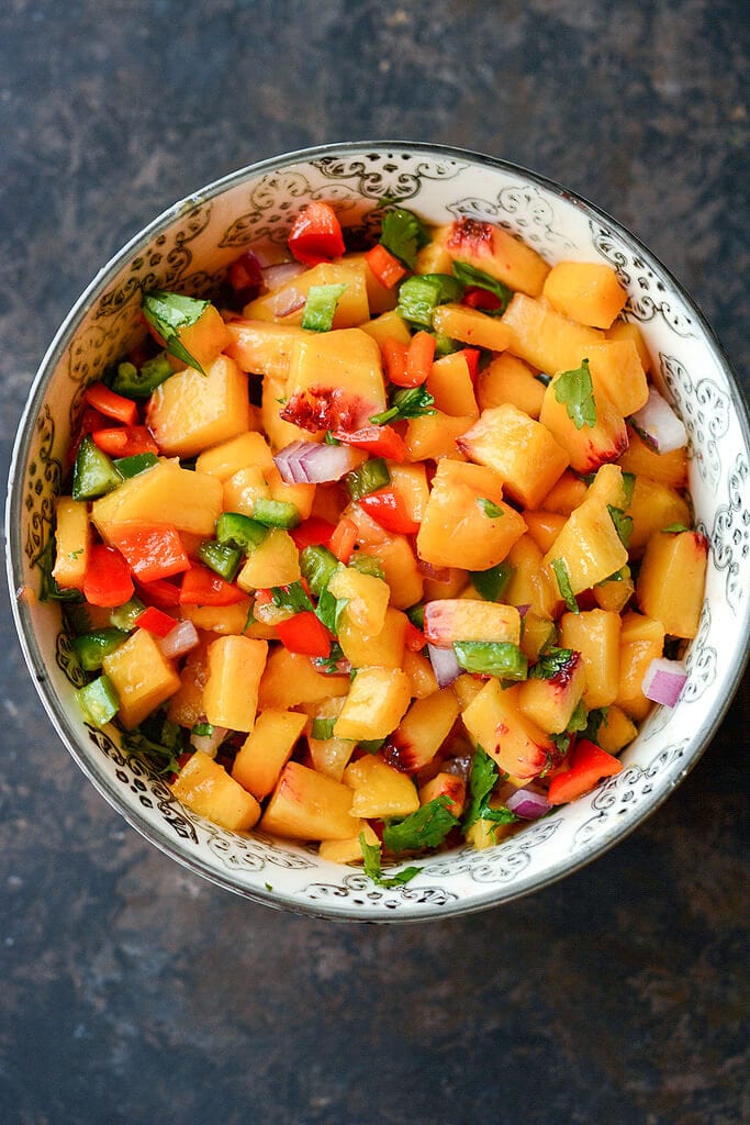 Bowl of fresh peach salsa - Slow Cooker Pork Chops with Peach Salsa Recipe