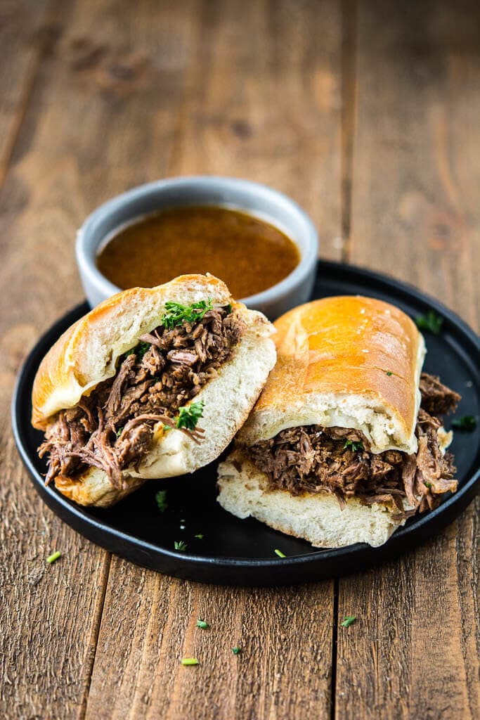 The most tender roast beef and tasty au jus makes the best French Dip Sandwiches. These can be made in the slow cooker or the Instant Pot for a quick and easy meal!