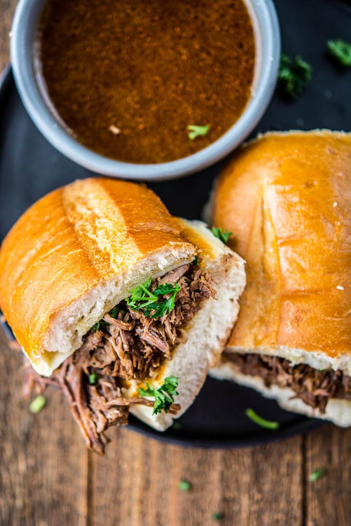 The most tender roast beef and tasty au jus makes the best French Dip Sandwiches. These can be made in the slow cooker or the Instant Pot for a quick and easy meal!