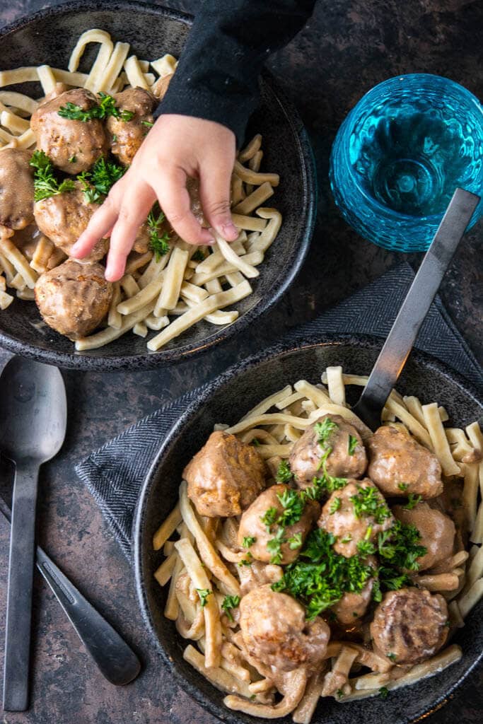 Slow Cooker Swedish Meatballs in black bowls on table