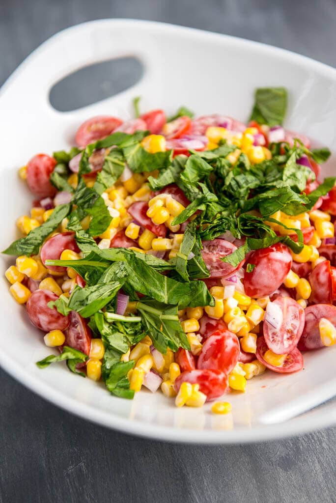The perfect side dish all summer long! Corn and Tomato Salad is so simple to prepare, so fresh and always a hit!