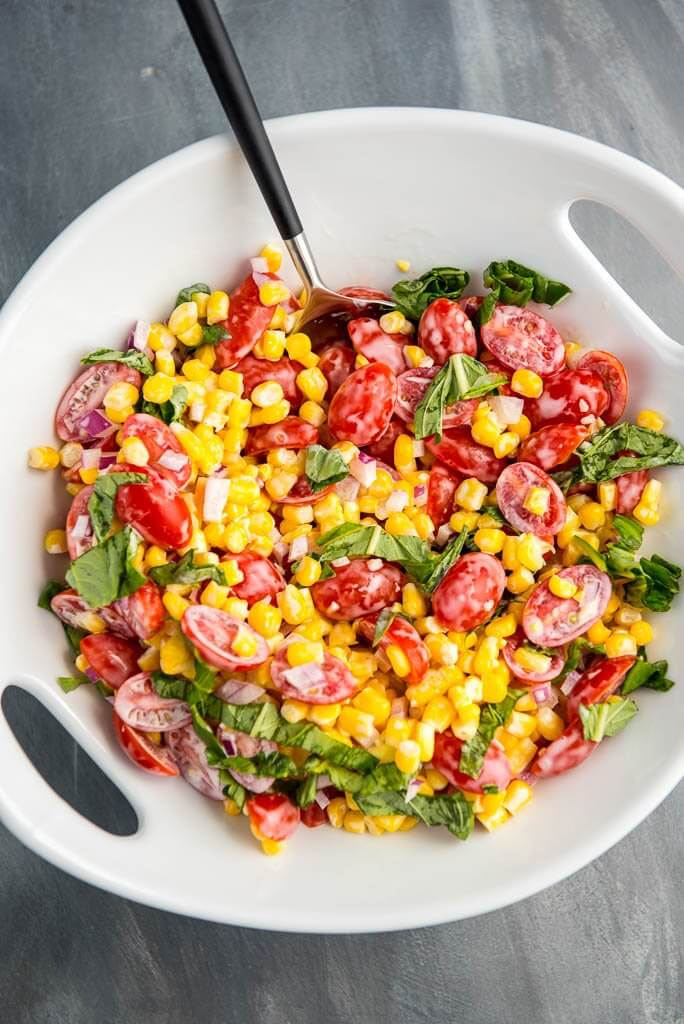 The perfect side dish all summer long! Corn and Tomato Salad is so simple to prepare, so fresh and always a hit!