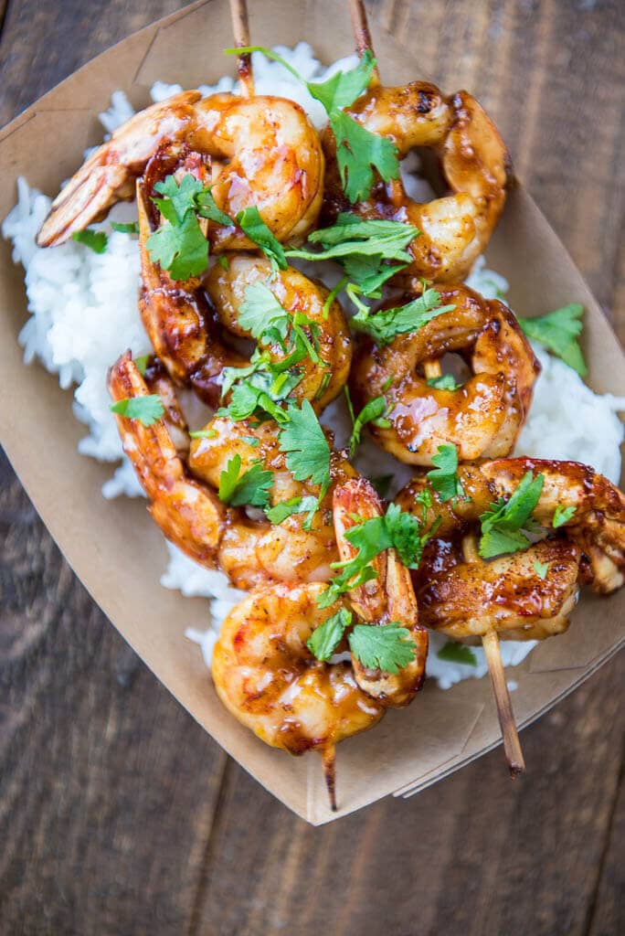 The perfect summer meal! With a slightly spicy sauce these Raspberry Chipotle Shrimp can be cooked on the grill or in your favorite pan for a quick weeknight meal.