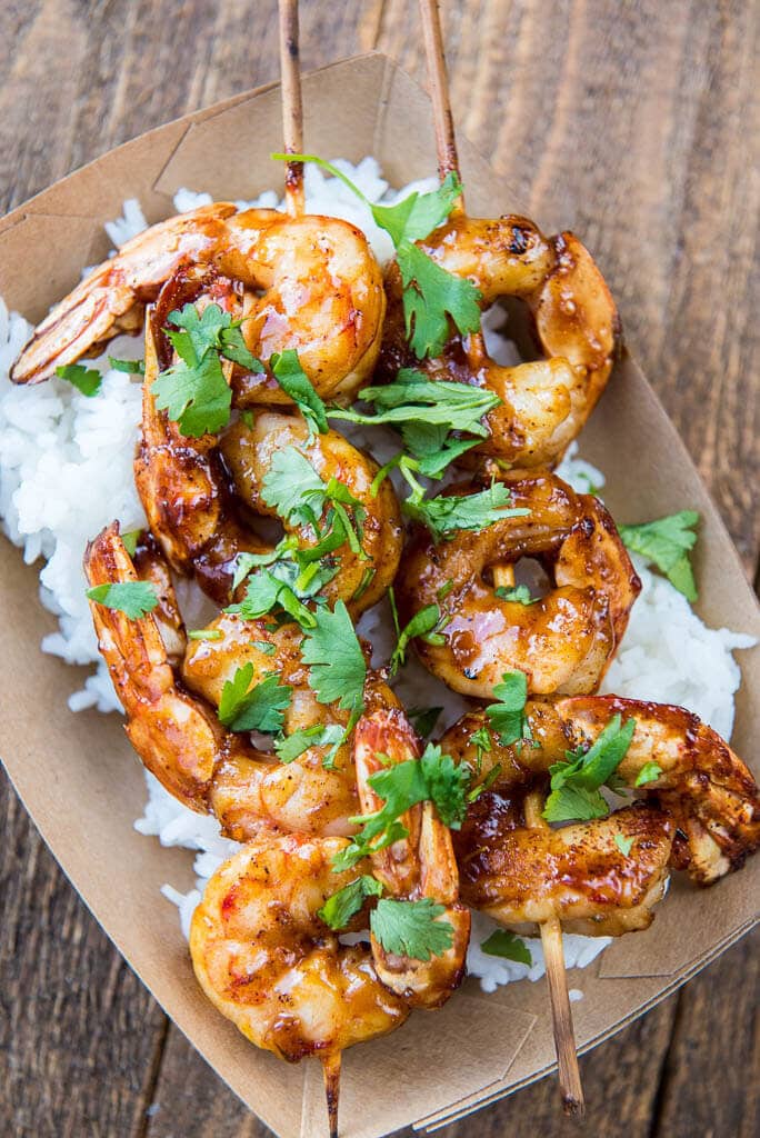 The perfect summer meal! With a slightly spicy sauce these Raspberry Chipotle Shrimp can be cooked on the grill or in your favorite pan for a quick weeknight meal.