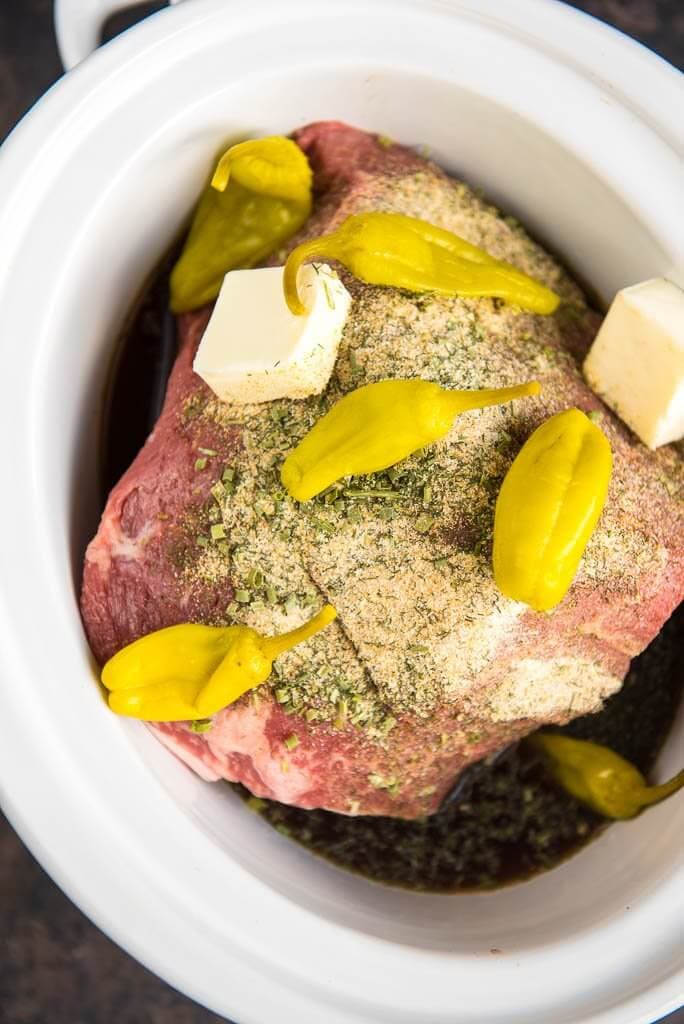 Slow Cooker Mississippi Pot Roast is a simple way to take your dinner from average to amazing! Mezzetta Pepperoncini Peppers give a tasty twist to roast beef for the ultimate family meal.