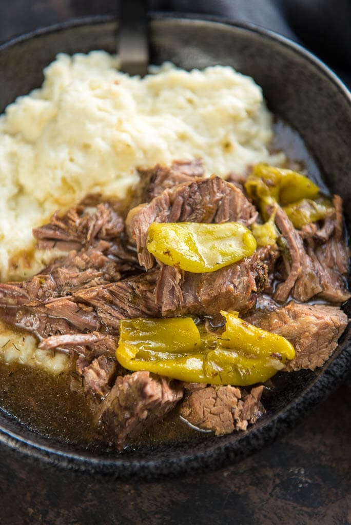 Slow Cooker Mississippi Pot Roast is a simple way to take your dinner from average to amazing! Mezzetta Pepperoncini Peppers give a tasty twist to roast beef for the ultimate family meal.