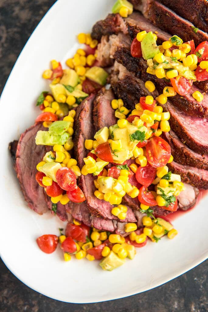 When looking for the best slow cooked beef look no further than this Grilled Tri Tip Roast with Corn Salsa.  Amazing on the smoker or pellet grill, you won't get better flavor or more tender meat than this simple delicious meal.