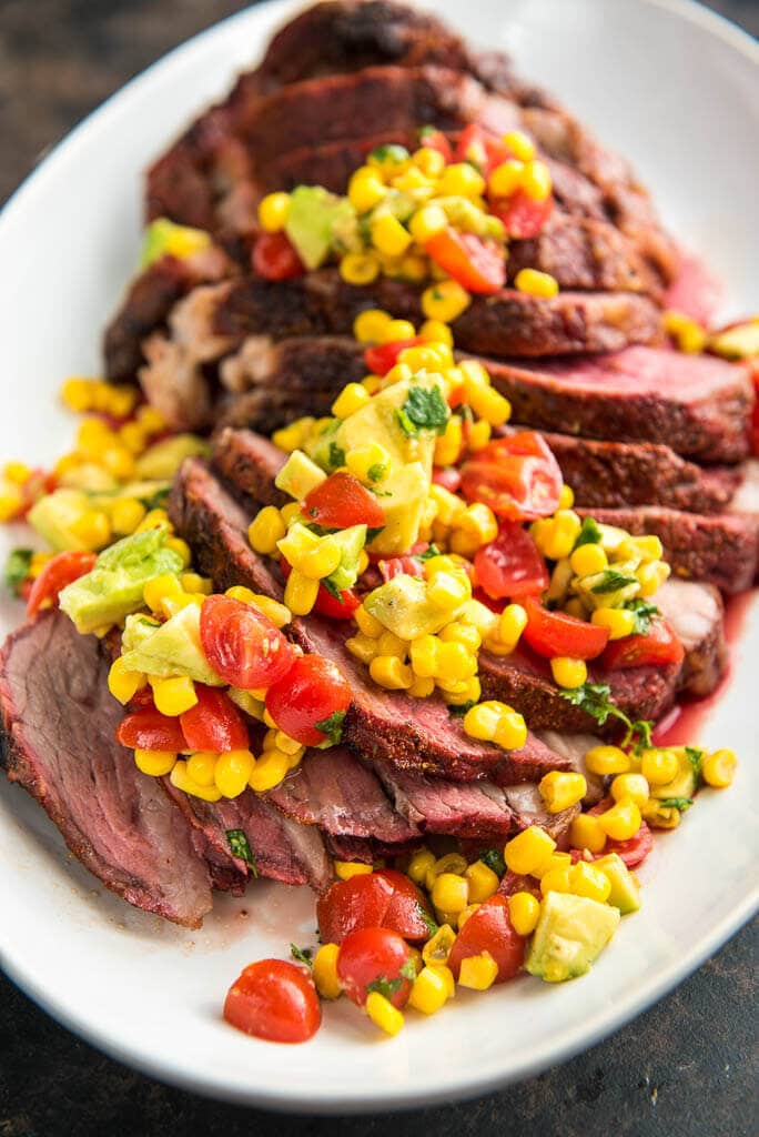 When looking for the best slow cooked beef look no further than this Grilled Tri Tip Roast with Corn Salsa.  Amazing on the smoker or pellet grill, you won't get better flavor or more tender meat than this simple delicious meal.