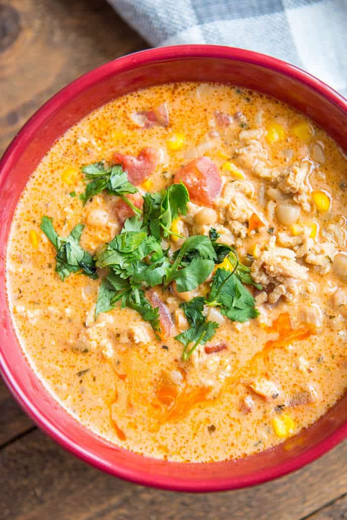 top view of buffalo chicken chili in red bowl