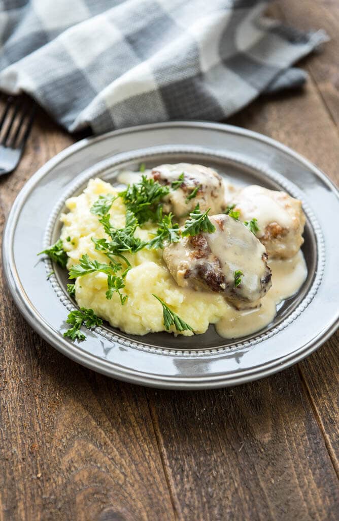 A flavorful seasoning blend makes these Slow Cooker Chicken Meatballs with Cream Sauce a quick and delicious weeknight meal idea!