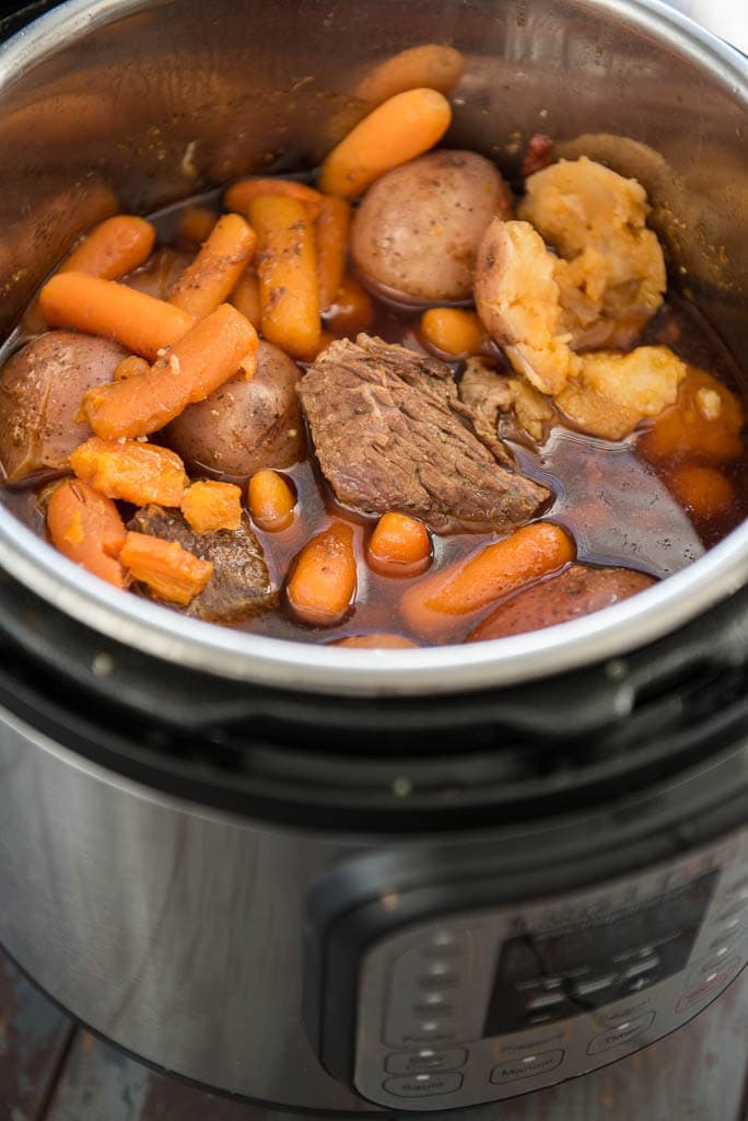 Pressure Cooker Pot Roast cooked in an Instant Pot with potatoes, carrots and juices