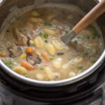 chicken and dumplings in the Instant Pot pressure cooker with ladle